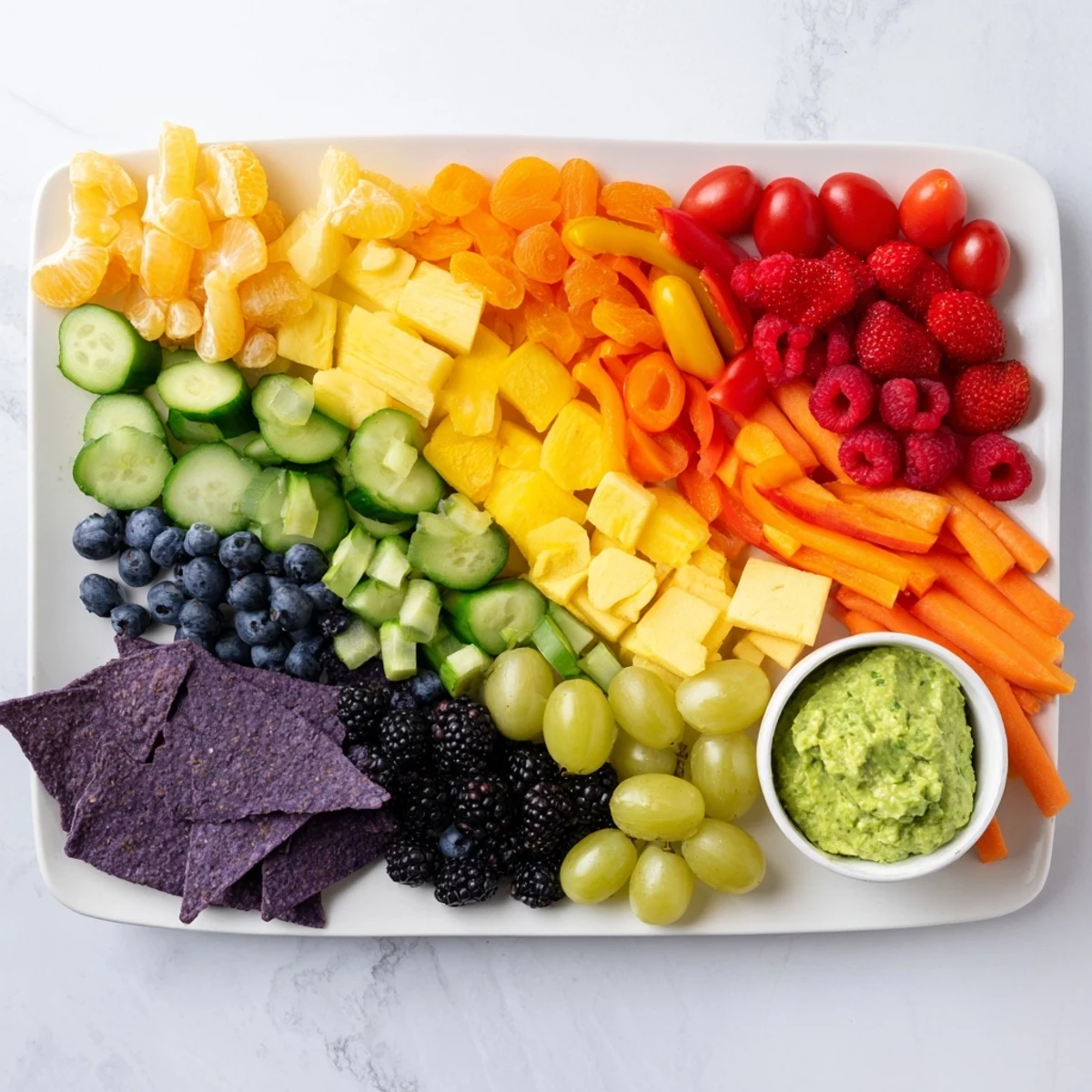 Vivid Rainbow Pride Spectrum board showcasing red strawberries, orange mandarins, and other beautifully arranged ingredients.