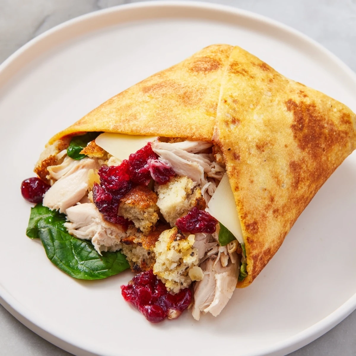 Toasted Moist Maker Chicken Wrap, showcasing a cross-section revealing juicy chicken and savory stuffing inside.