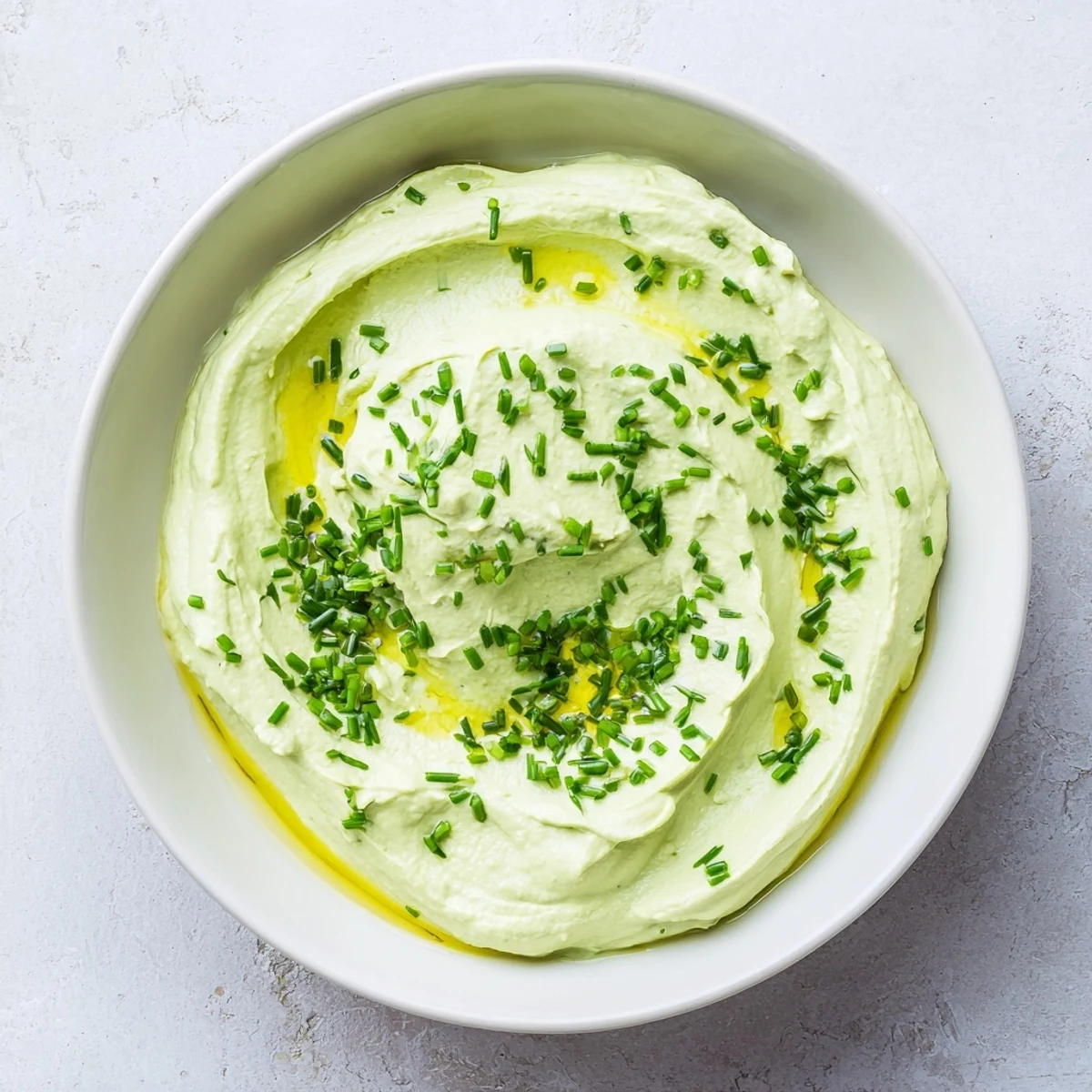 Vibrant green avocado cottage cheese dip, a tasty appetizer or snack, ready in minutes.