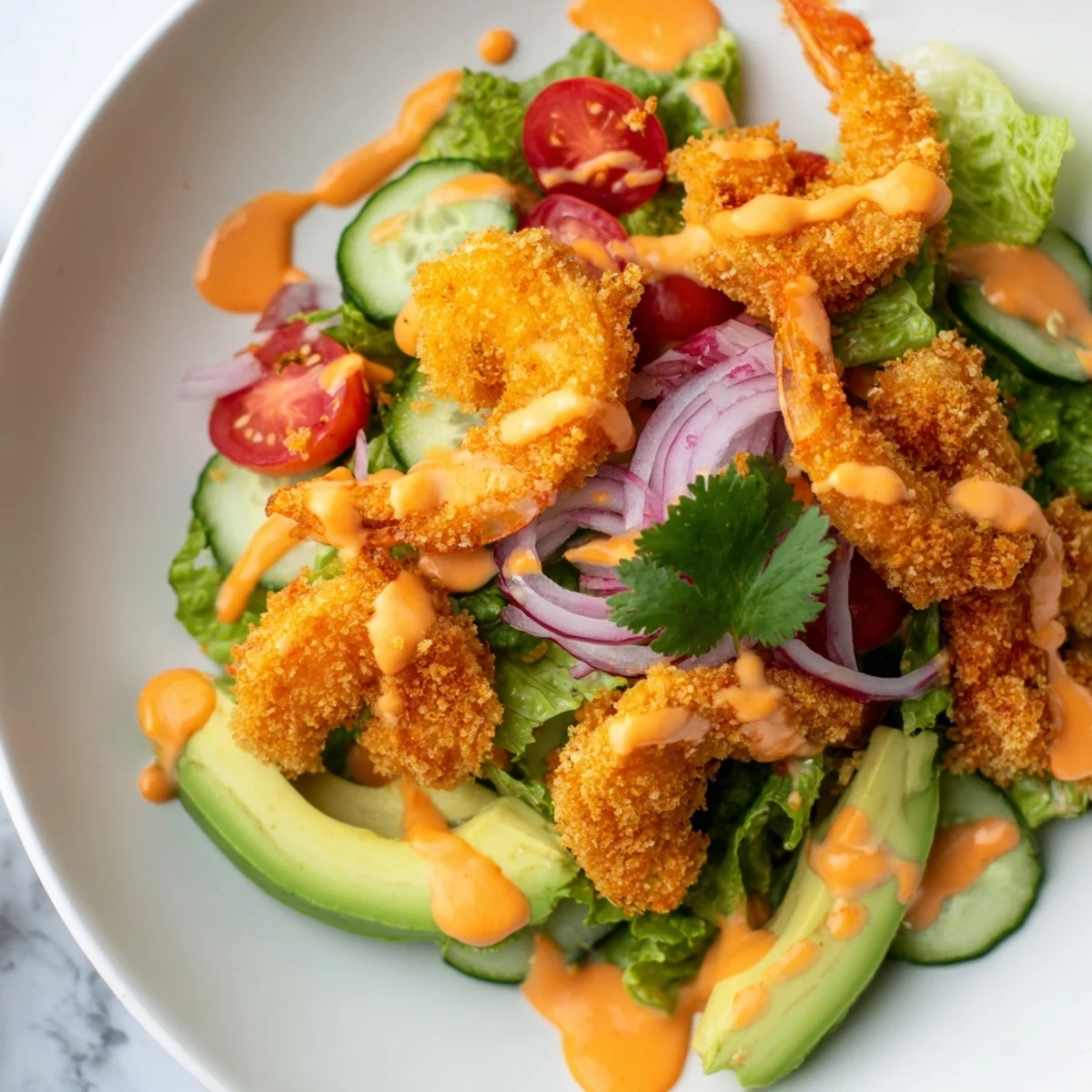 Crispy golden shrimp atop a vibrant salad, complete with the refreshing Spicy Crispy Shrimp Salad.