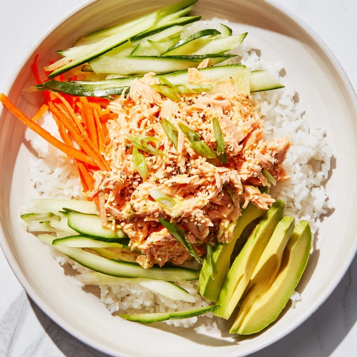 A vibrant bowl of Spicy Canned Salmon Rice Bowl, offering a delicious, healthy, and flavorful meal.