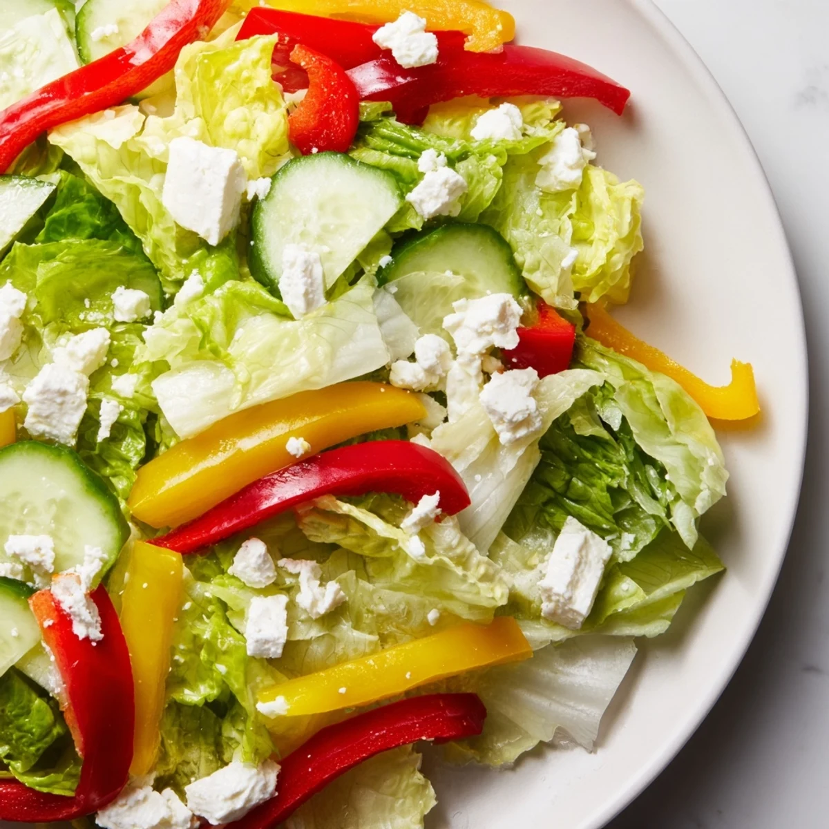 Crisp, refreshing Bella Hadid Salad with vibrant red peppers and creamy feta, perfect for a light meal.