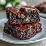 Decadent Cadbury Egg chocolate brownies with a rich, fudgy center and crunchy crumbled chocolate topping.