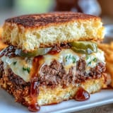 Memorial Day BBQ smash burger sliders piled high with shredded lettuce, pickles, and zesty secret sauce for a crowd-pleasing feast.  