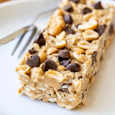 Irresistibly chewy No-Bake Peanut Butter Oat Bars topped with rich chocolate chips.  
