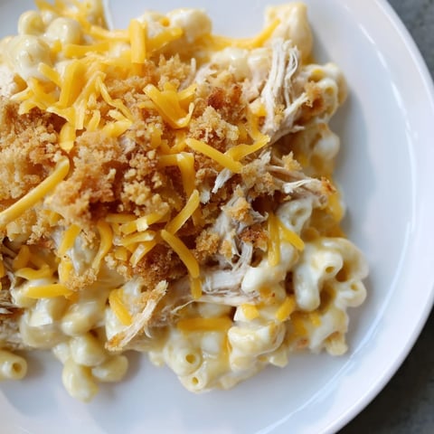 Golden-brown Classic Mac & Cheese with BBQ Chicken, a family favorite bubbling hot from the oven.