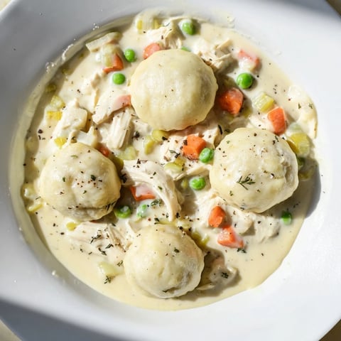Chicken and Dumplings Casserole: A steaming, bubbly casserole with golden dumplings and tender chicken.