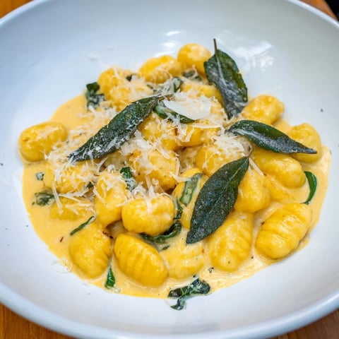 Golden-hued One-Pot Creamy Pumpkin Sage Gnocchi Pasta, a comforting autumn dish ready to serve.