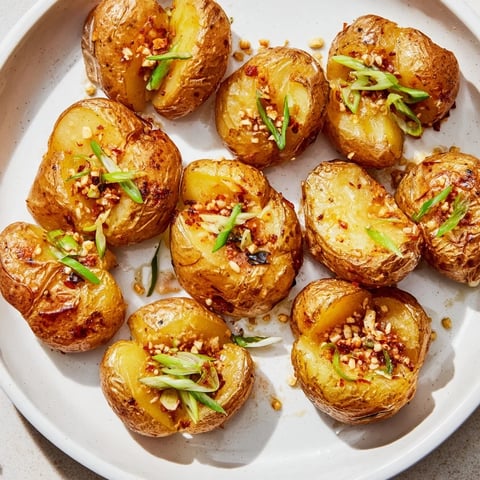 Golden, crispy Smashed Green Onion Potato Bombs, a vegetarian side dish bursting with fresh scallion flavor.