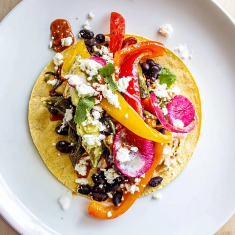 A close-up of a gorgeous Desert Bloom Cactus Taco Board with warm tortillas ready to be filled.