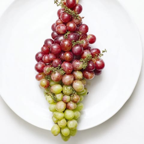 This elegant Vineyard Grape Cluster features red and green grapes, perfect for any party platter.
