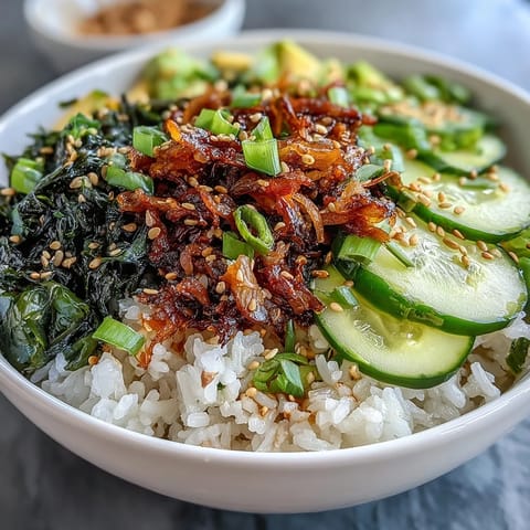 Seaweed & Nori Rice Bowl with crisp cucumber, sesame seeds, and nori strips for a fresh, umami-packed meal.