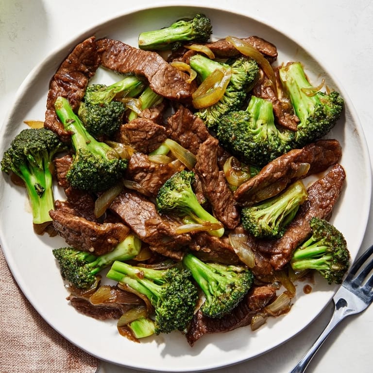Colorful Easy Beef and Broccoli Stir-Fry in a hot skillet with garlic aroma 