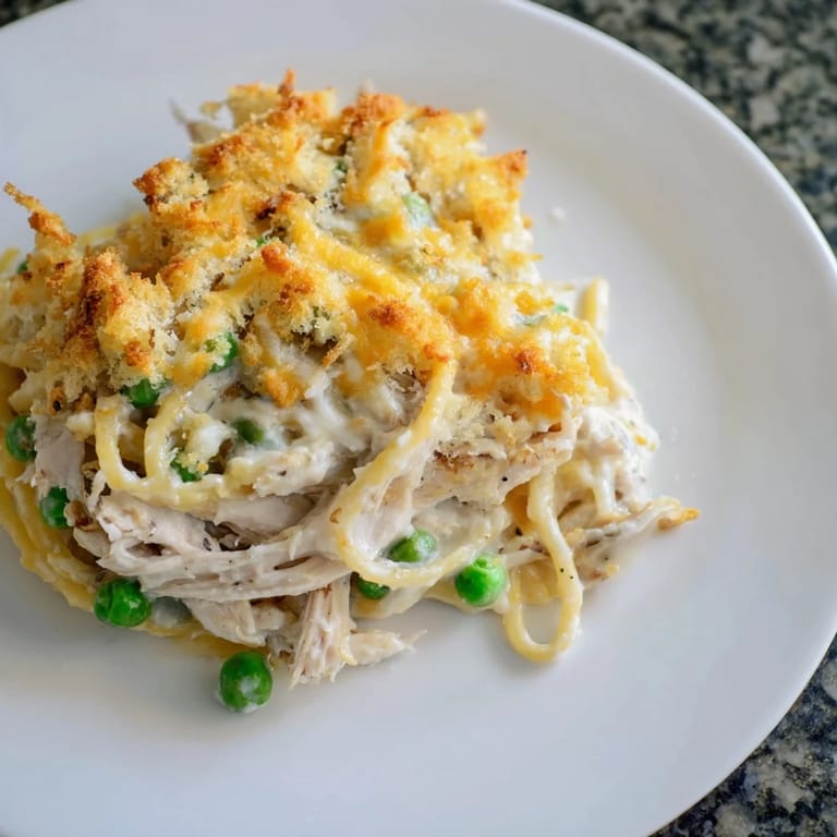 Deliciously comforting Turkey Tetrazzini, featuring tender chicken or turkey, bubbling under a toasted topping.