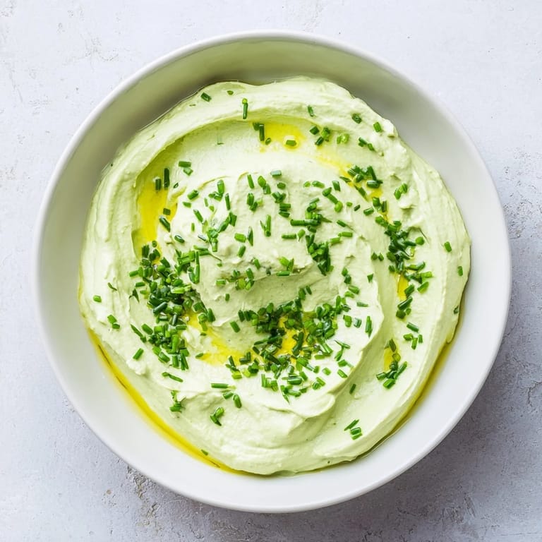 Vibrant green avocado cottage cheese dip, a tasty appetizer or snack, ready in minutes.